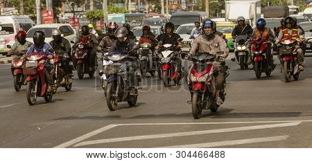Bangkok, Tahiland - 2019-03-19 - Motorcycles Fill The Streets Of Bangkok And Zoom Ahead At Traffic L
