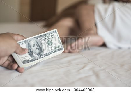 Prostitution, Human Trafficking.prostitute Takes Money For Her Work.man Paying Prostitute For Sex