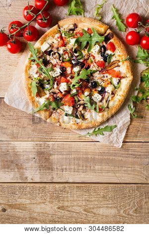 Vegetable Italian Pizza With Tomatos On Wodeen Background, Copy Space, Top View, Vertical