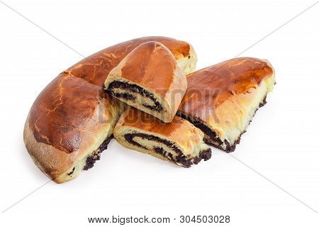 Whole And Partly Cut Homemade Pies With Sweet Crushed Poppy Seed Filling On A White Background