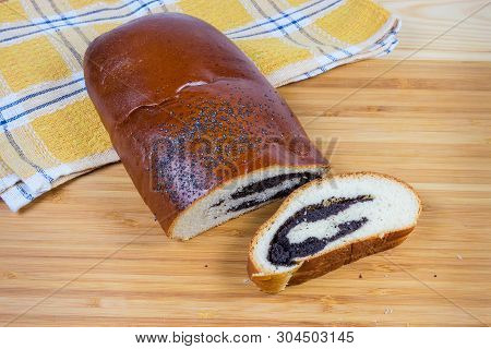 Partly Cut Of The Pie With Sweet Crushed Poppy Seed Filling And Sprinkled With Whole Poppy Seeds On 