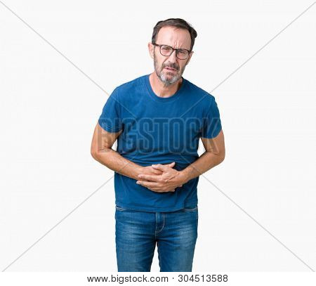 Handsome middle age hoary senior man wearin glasses over isolated background with hand on stomach because indigestion, painful illness feeling unwell. Ache concept.