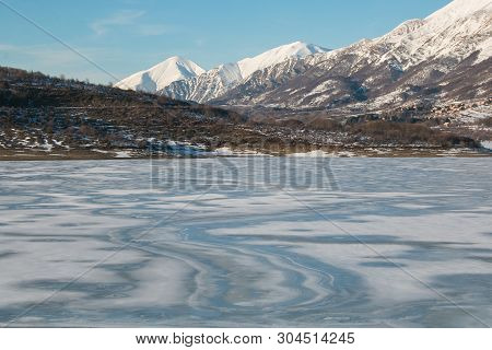 View Of Frozen Campotosto Lake In Abruzzo At Winter Time