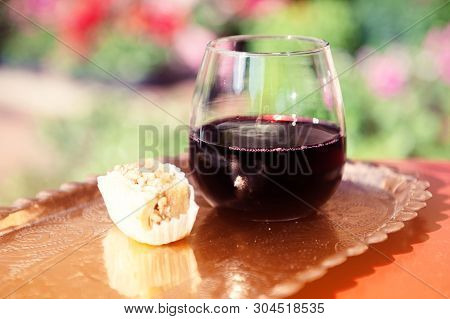 Glass Filled With Red Grape Juice. Musht Albanian Traditional Beverage