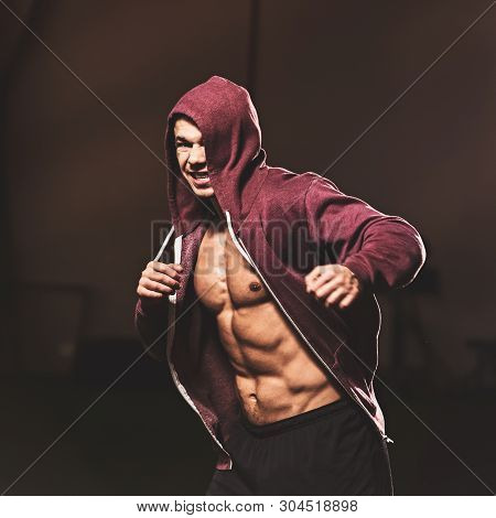 Strong Muscular Fighter Training Hard In Modern Gym