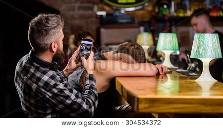 Hipster Taking Photo Drunk Friend. Drunk Friends In Bar. Fall Asleep At Bar Counter. Take Photo To R