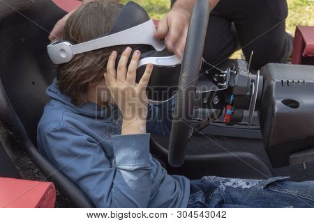 Child Wearing Vr Glasses Driving A Car