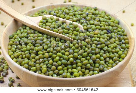 Green Bean Or Mung Bean In Bowl And Sack Background.