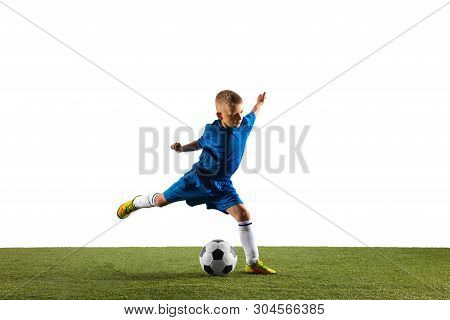 Young Boy As A Soccer Or Football Player In Sportwear Making A Feint Or A Kick With The Ball For A G