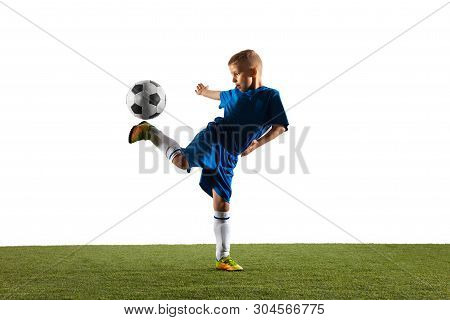 Young Boy As A Soccer Or Football Player In Sportwear Making A Feint Or A Kick With The Ball For A G