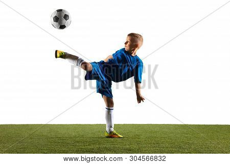 Young Boy As A Soccer Or Football Player In Sportwear Making A Feint Or A Kick With The Ball For A G