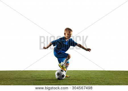 Young Boy As A Soccer Or Football Player In Sportwear Making A Feint Or A Kick With The Ball For A G