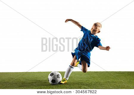 Young Boy As A Soccer Or Football Player In Sportwear Making A Feint Or A Kick With The Ball For A G