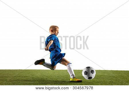 Young Boy As A Soccer Or Football Player In Sportwear Making A Feint Or A Kick With The Ball For A G