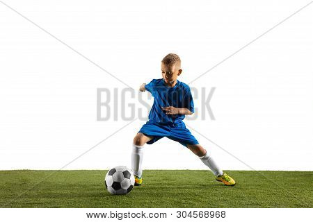 Young Boy As A Soccer Or Football Player In Sportwear Making A Feint Or A Kick With The Ball For A G