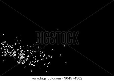 Split Debris Of Stone Exploding Against Black Background.
