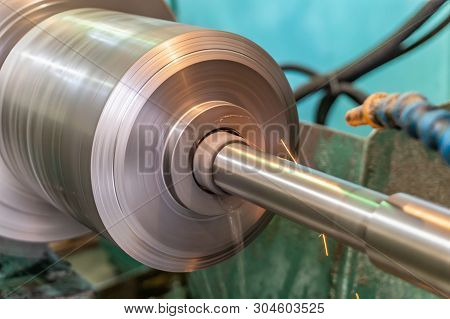 Internal Grinding Of A Metal Part On A Circular Grinding Machine With Sparks And Water Cooling.