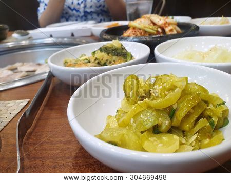 Korean Food Style, Top View Of Quick Cucumber Kimchi Or Spicy Cucumber Salad On White Plate In Resta