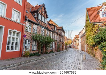 Street With Medieval Old Brick Buildings In Luneburg. Germany