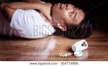 Man Lay On The Floor Of The Room With Symptoms Of Torture From Eating Poison For Suicide, White Bott
