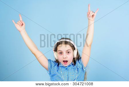 Shes A Rock Star. Little Kid Showing Horn Hand Gesture Like A Hard Rock Or Heavy Metal Fan. Cute Sma