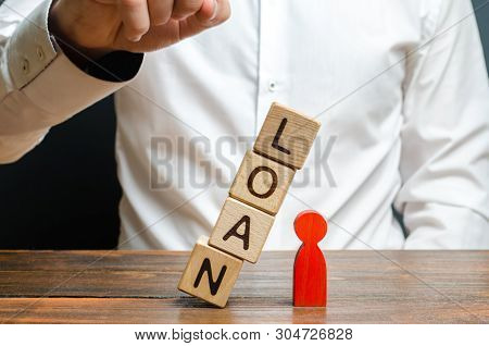 Man Pushes Downs A Cube Tower With The Word Loan On The Red Man Figure. Lack Of Protection For Vulne