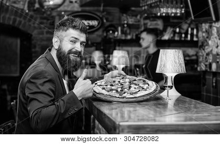Hipster Hungry Eat Italian Pizza. Hipster Client Sit At Bar Counter. Man Received Delicious Pizza. E
