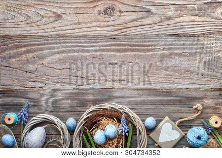 Easter Background With Blue Hyacinth Flowers, Easter Eggs, Wooden Heart And Decorations On Rustic Wo