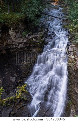 A Close Up View Of A Majestic Waterfall In Monkman Provincial Park, Canada, The Torrent Of Water Squ