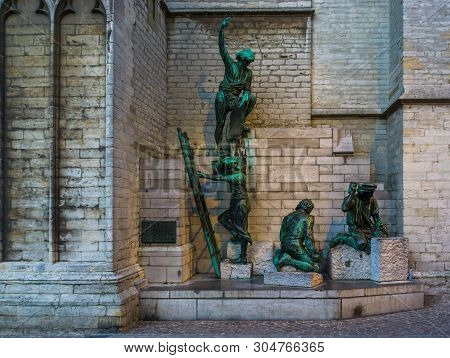 Statues Of Construction Workers At The Vrouwekathedraal Of Antwerp City, Antwerpen, Belgium, April 2