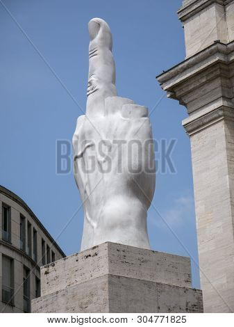 Milan, Italy - May 25, 2019: Middle Finger Sculpture And Mezzanotte Palace Facade In Milan Stock Exc