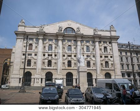 Milan, Italy - May 25, 2019: Mezzanotte Palace Facade And Middle Finger Sculpture In Milan Stock Exc