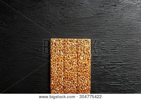 Tile Kozinaki From Sunflower Seeds On A Black Textural Background. Delicious Oriental Sweets Gozinak