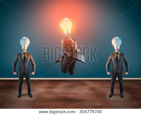 Group Of Business Man With Lightbulbs Instead Of Head. Lit Lightbulb Businessman Jumping.
