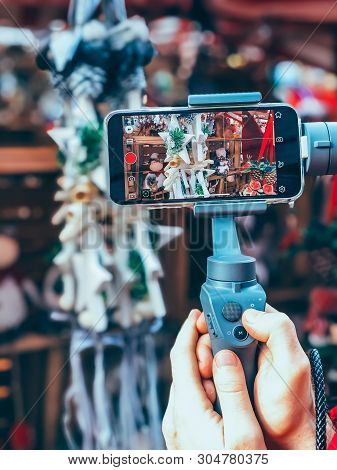 Germany, Nuremberg - December 17, 2018: Close-up Of Man Blogger Hands Shooting Video On Smartphone I