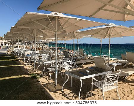 Nikiti Beach Is In The Village Of Nikiti With Sun Beds And Umbrellas, Sithonia Peninsula, Chalkidiki