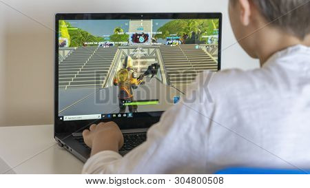 Vilnius, Lithuania - June 02, 2019: Boy Playing Fortnite. Fortnite Is Online Video Game Developed By