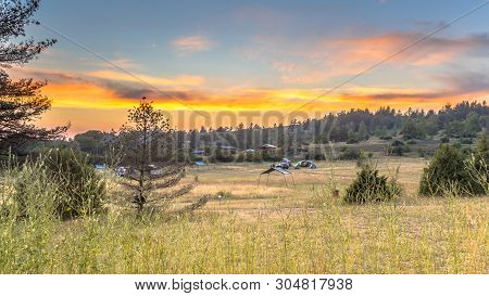 Sunset Over Camping Ground On Plateau Of The Causse Noir In Cevennes National Park, Occitanie, Franc
