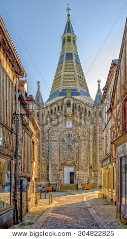 Domfront, France, Feb 2019, View Of Saint-julien Church From The Street On A Sunny Day, In A Medieva