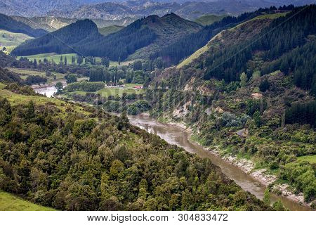 The Mighty River Winding Its Way Through The Mountains