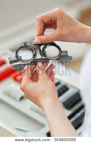 Accurate Doctor Taking Out Professional Glasses For Examination Of Eye Size