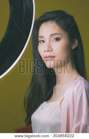 Beautiful Asian Woman Model  Take A Selfie Photo In Front Of Studio Light.