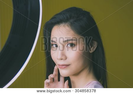 Beautiful Asian Woman Model  Take A Selfie Photo In Front Of Studio Light.