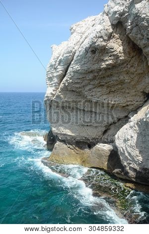 Rosh Ha Nikra. Israel. Sea Waves And White Rock. A Unique Tourist Attraction Located On The North-we