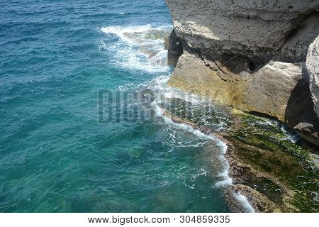 Rosh Ha Nikra. Israel. Sea Waves And White Rock. A Unique Tourist Attraction Located On The North-we