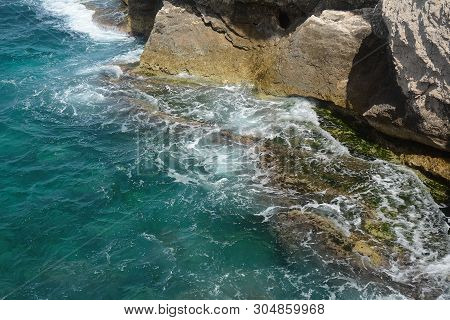 Rosh Ha Nikra. Israel. Sea Waves And White Rock. A Unique Tourist Attraction Located On The North-we