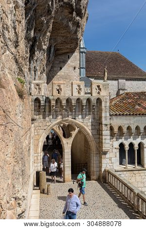 Rocamadour, France - September 3, 2018: Stone Walls Of Historic Basilica Of St-sauveur Blend Into Th