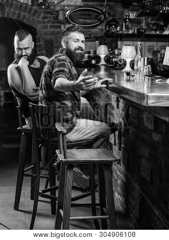 Hipster Brutal Bearded Man Spend Leisure With Friend At Bar Counter. Men Relaxing At Bar. Friday Rel