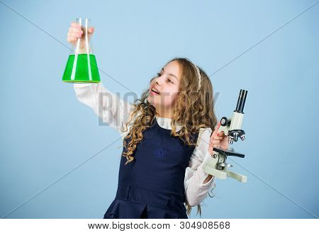 Child Study Bilogy Lesson. Discover Future. Small Girl Scientist With Testing Flask. Education And K