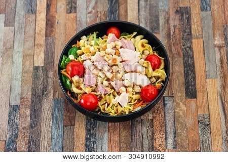 cereal specialties cooked with salad, roasted chicken aiguillette cured with salted and bacon